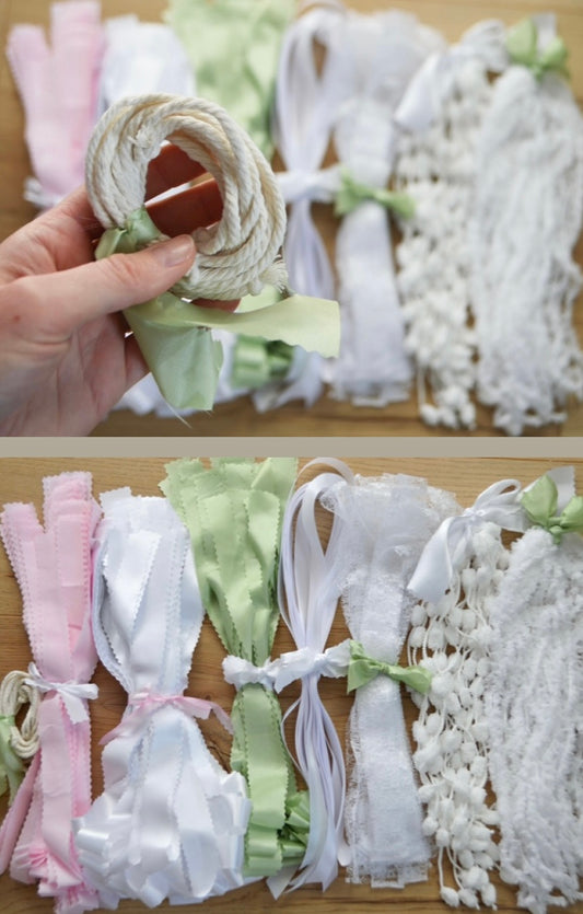 A DIY garland kit showing an assortment of ribbons and fabrics tied together in separate coloured bundles.